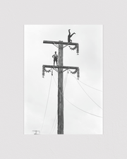 C. Cusack and mate on a Queen St, Levin transmission pole
