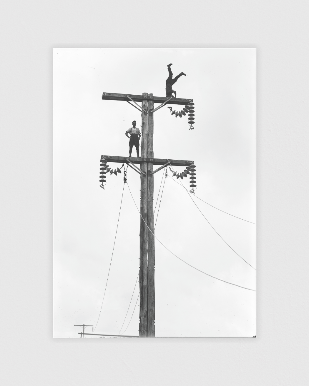 C. Cusack and mate on a Queen St, Levin transmission pole